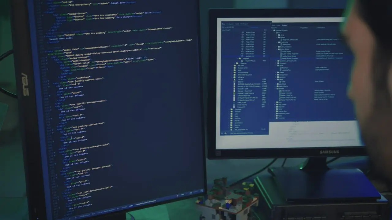 A programmer works at a large computer