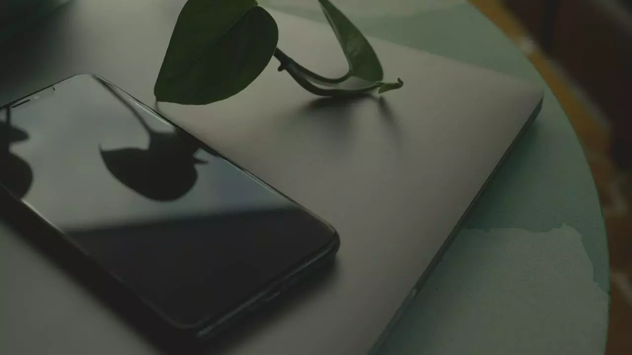 A phone on a laptop, two of the devices a test matrix covers